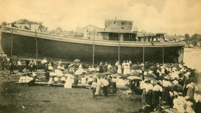 Postcard reproduction of ship launching from Milton docks